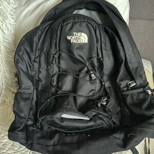 The North face Jester black backpack - dude pockets - great size
